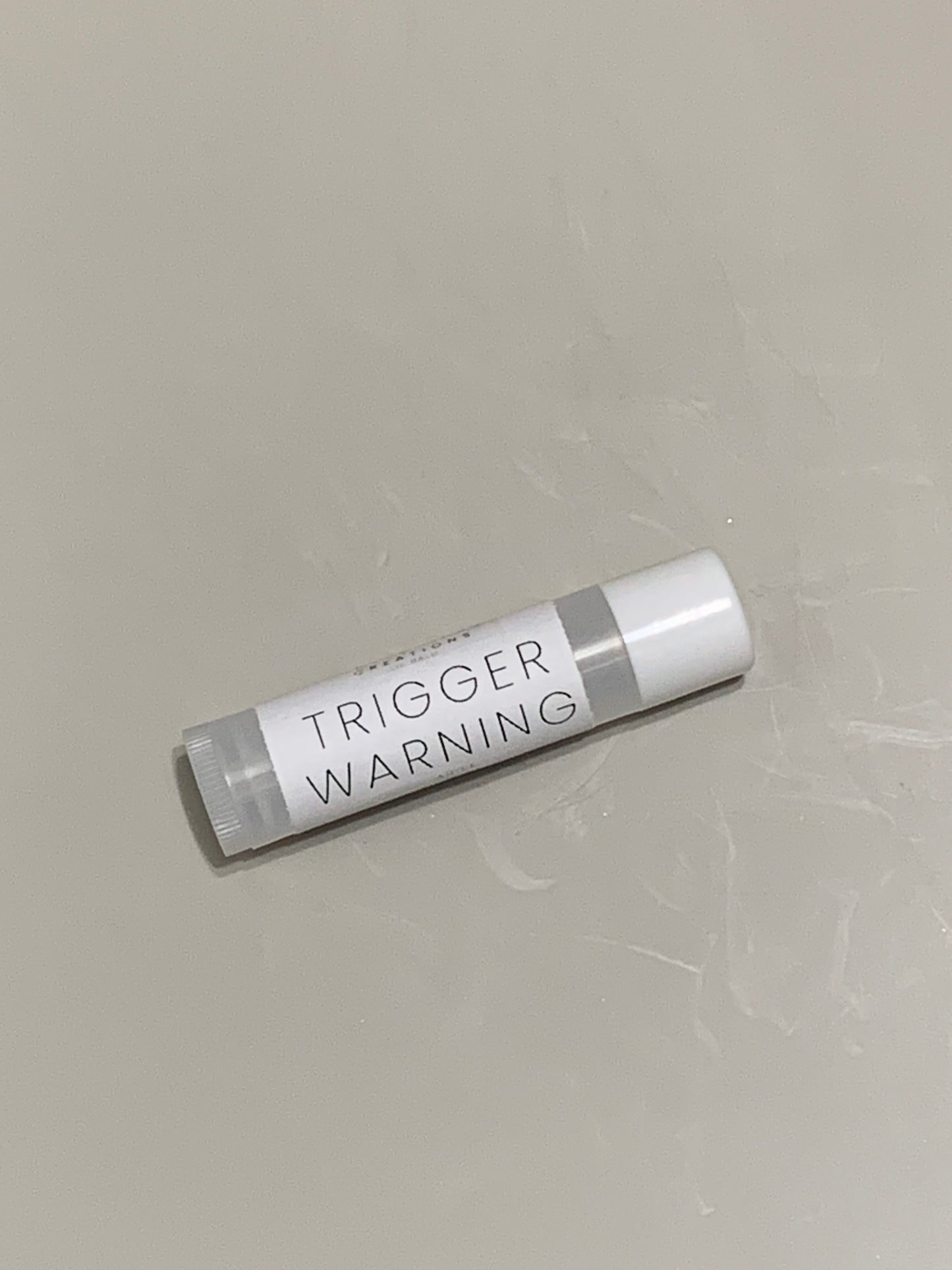 Trigger Warning lip balm
